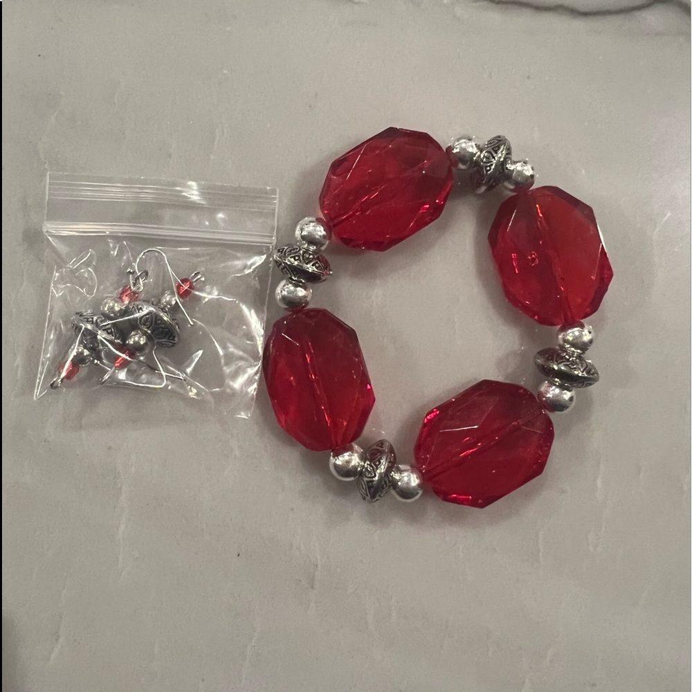 Custom made costume jewelry one pair of earrings and one bracelet.